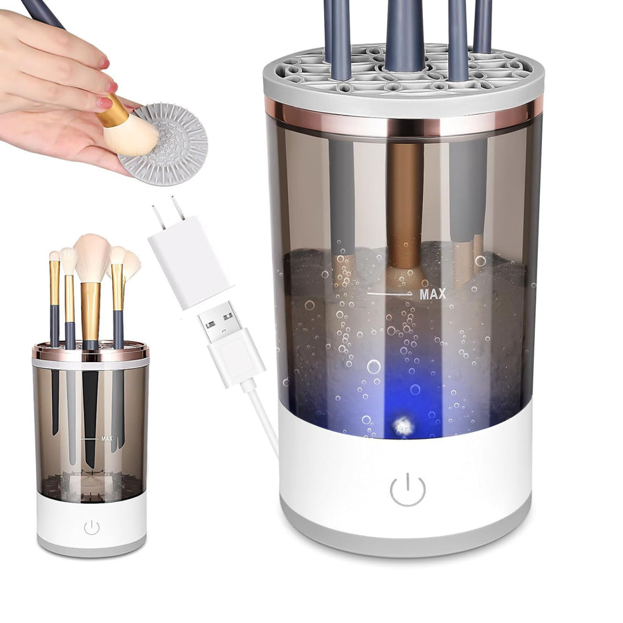 A white and gray electric makeup brush cleaner with a blue LED light, shown with a USB charging cable, a smaller empty view of the device, and a hand holding a brush in a cleaning brush holder.