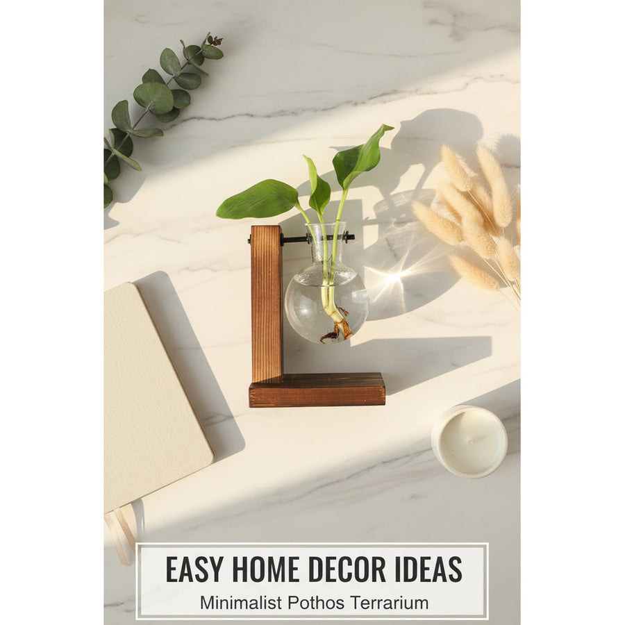 Glass vase with plant on a wooden stand on a table with a book and newspaper in the background