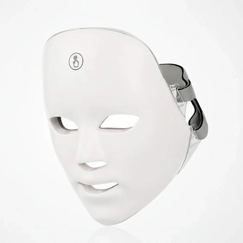 White LED face mask on a light gray background