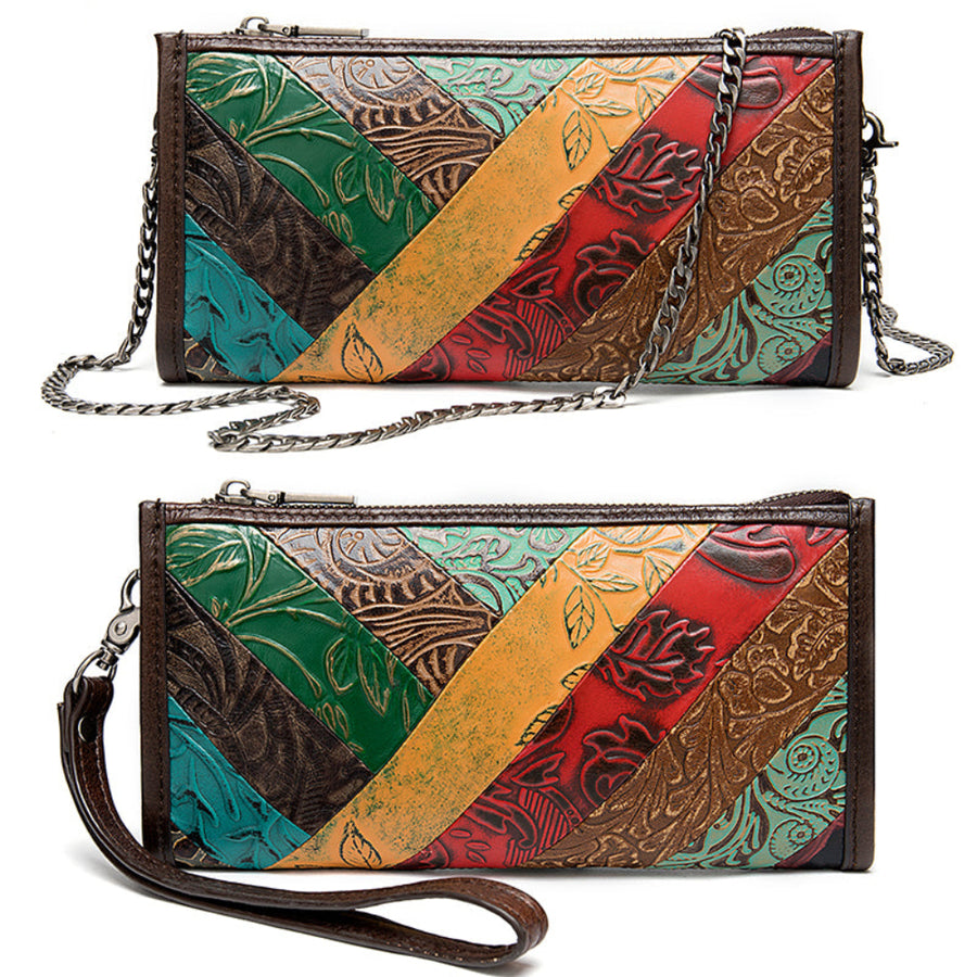 Colorful patchwork handbag with floral patterns on a white background