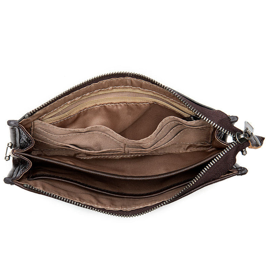 Brown leather bag with a zipper on a white background