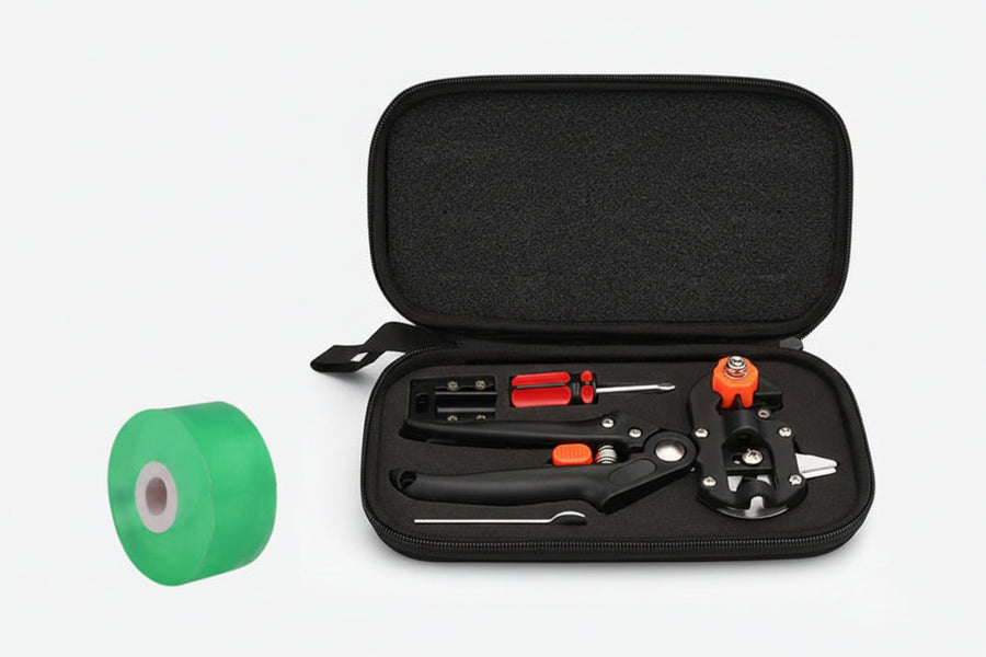 Black gardening tool set with green tape on a white background