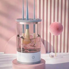 Makeup brush cleaner with brushes inside on a pink and white background