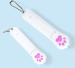 Two white nail polish bottles with pink paw prints on a light blue background