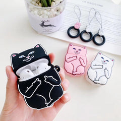 Black airpod case with cat designs held by a hand, with pink and white cat cases in the background.